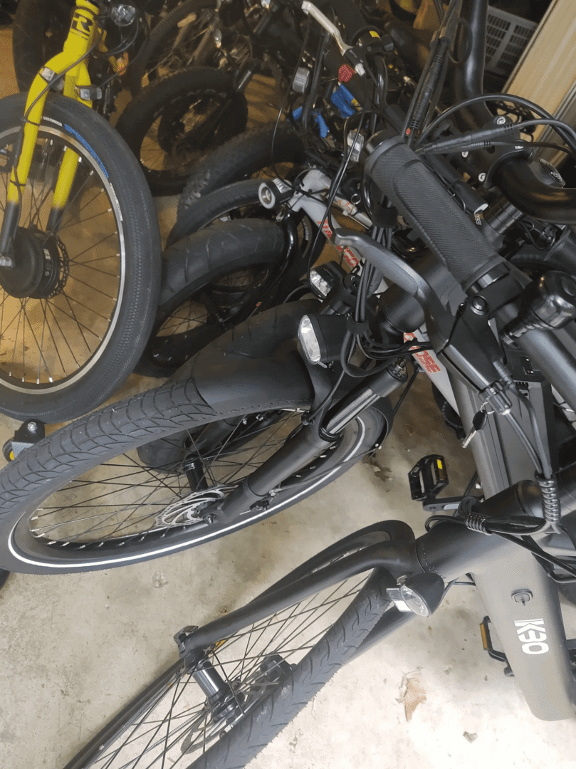 Black and yellow bicycles in storage