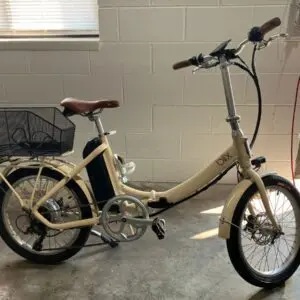 Beige folding bike with brown seat