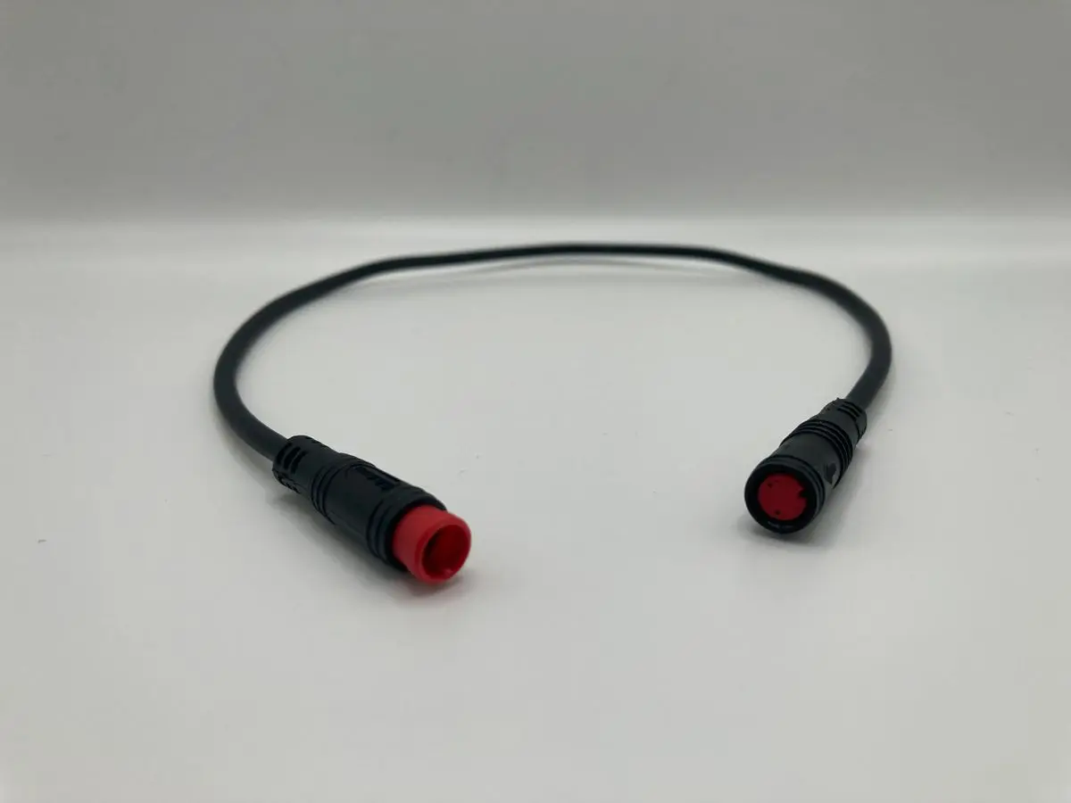 Short black cable with red circular ends