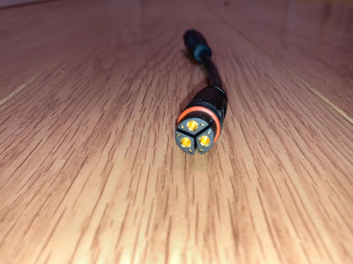 Connector with orange and black design on floor