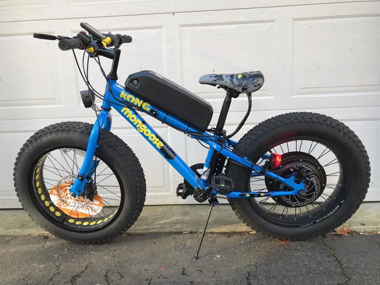 Custom blue electric bicycle in driveway