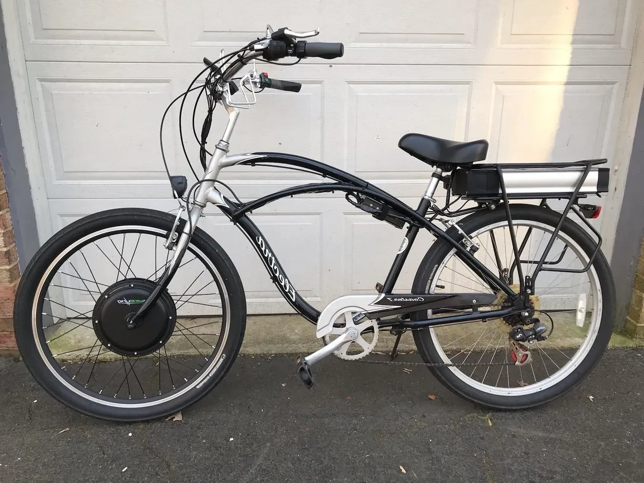 Electric bike parked by garage door