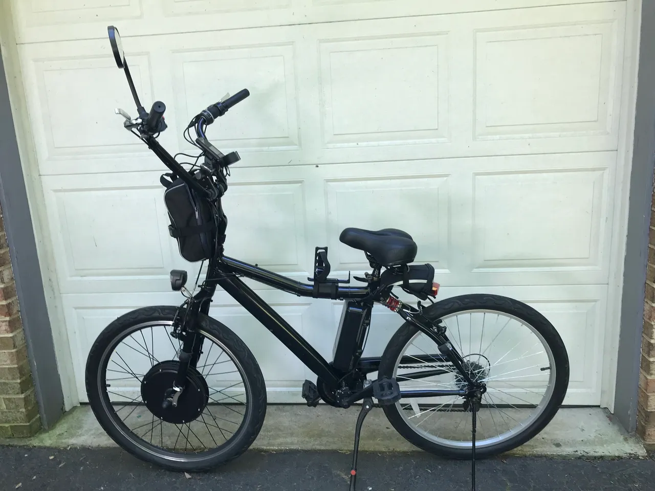 Electric bike parked by garage door