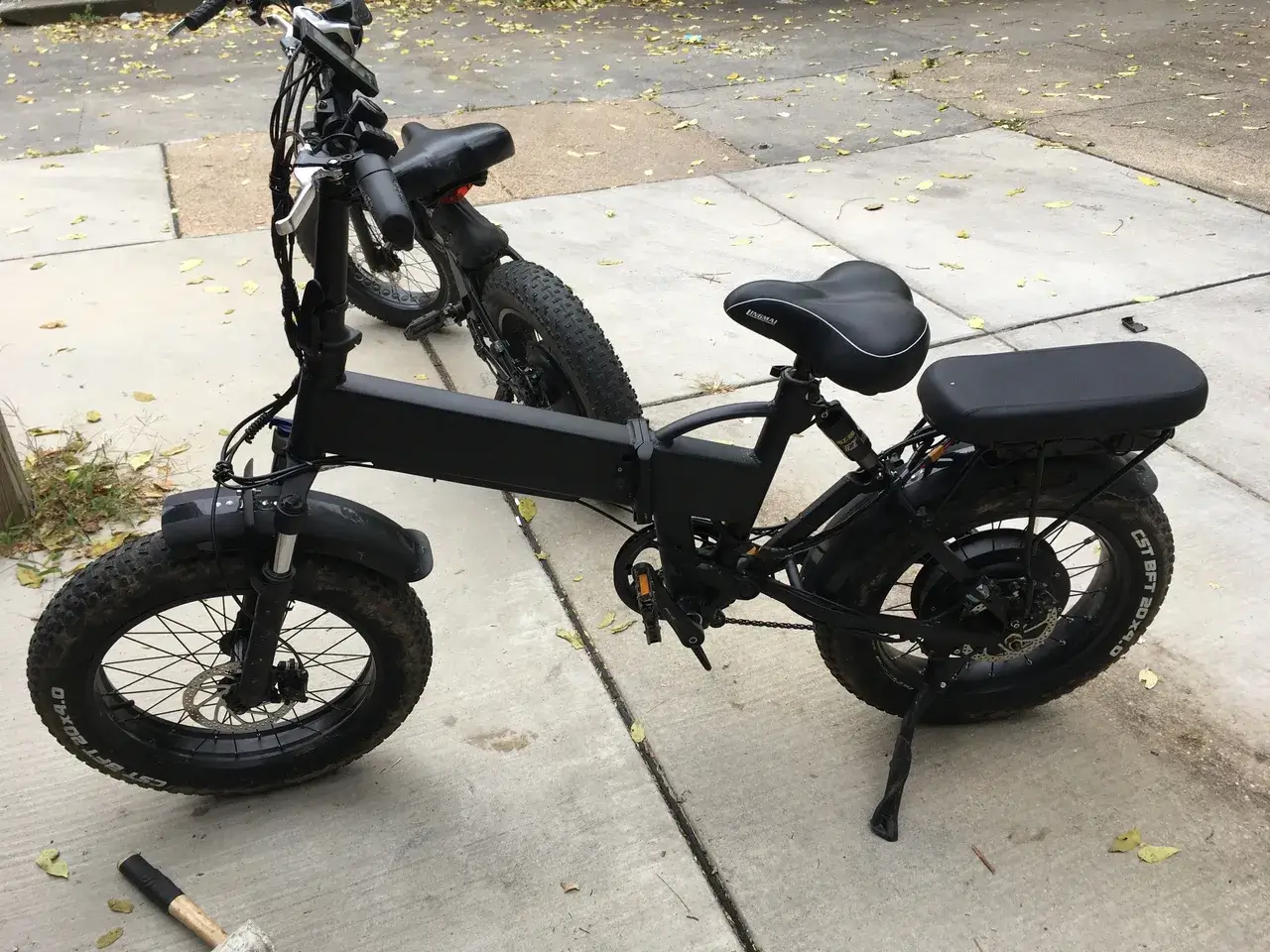 Two folding e-bikes outdoors