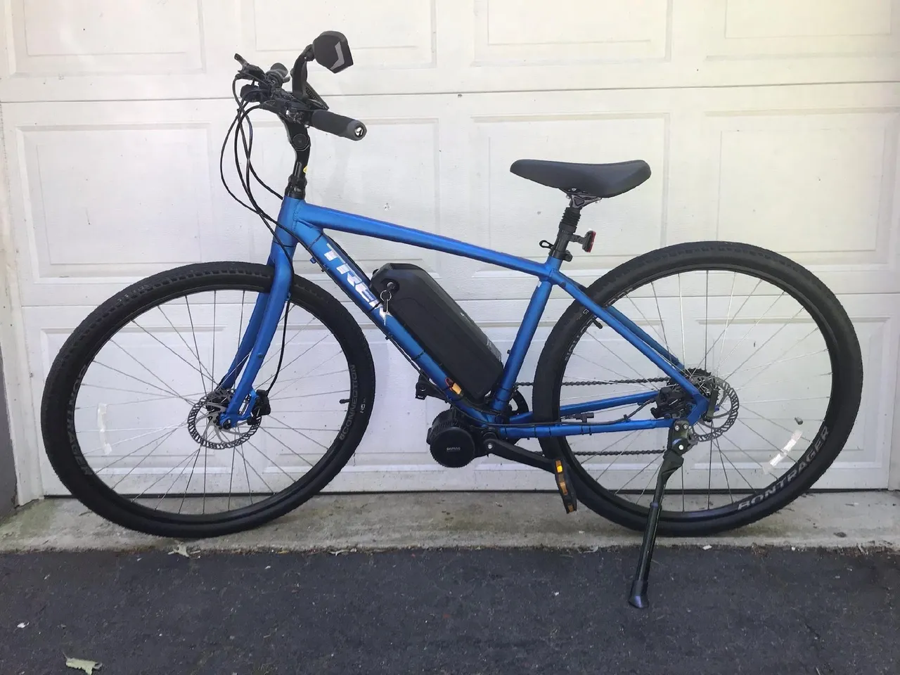 Side view of a blue e-bike