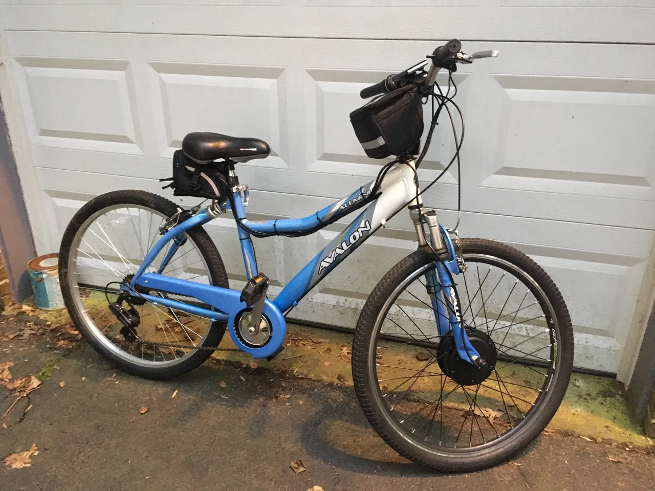 Side view of blue bicycle in driveway