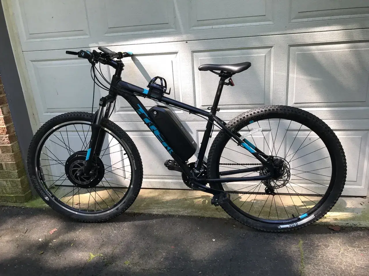 Electric mountain bike by garage door