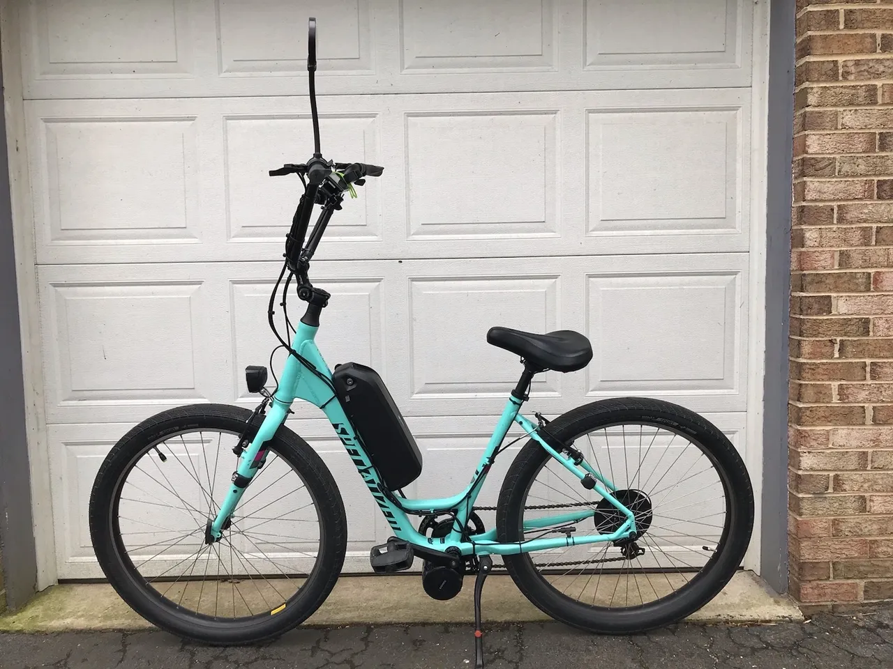 Electric bicycle with step-through frame