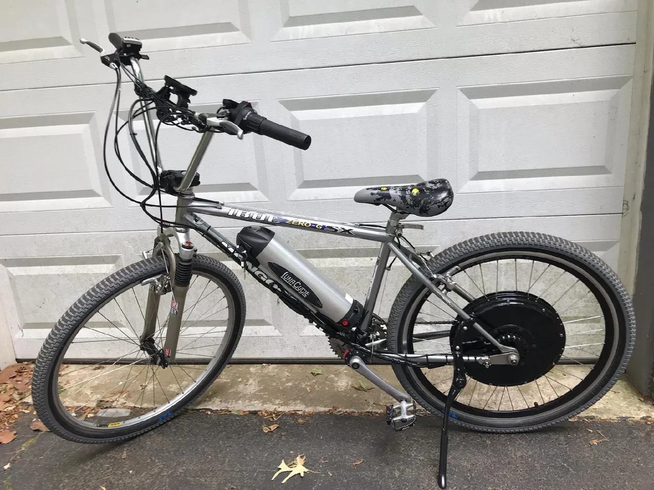 Hybrid bicycle in front of white door