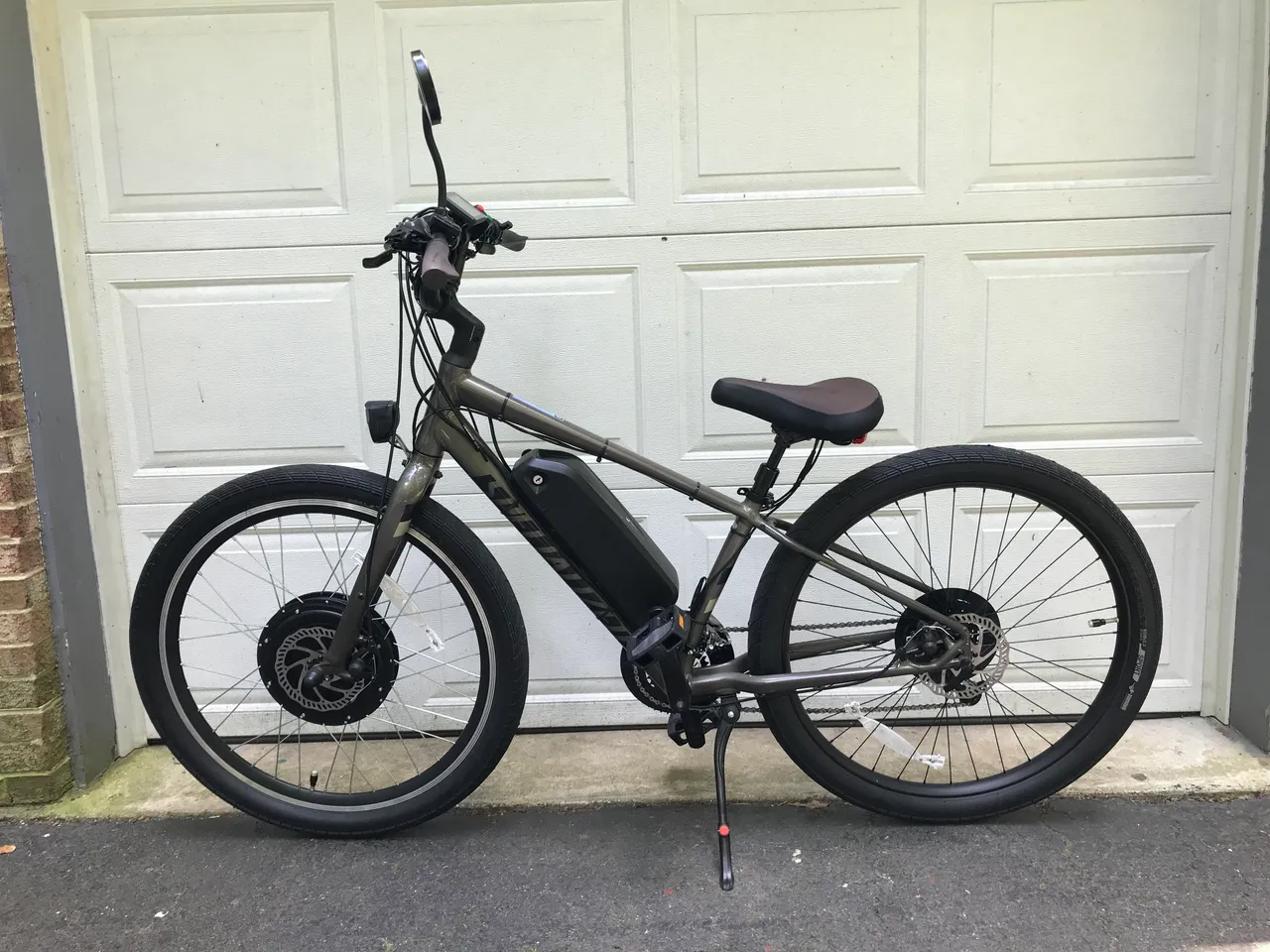 Electric bike parked by garage door