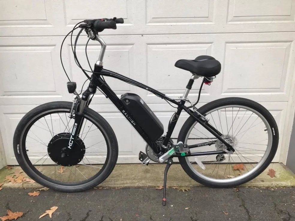 Modern electric bicycle on pavement.